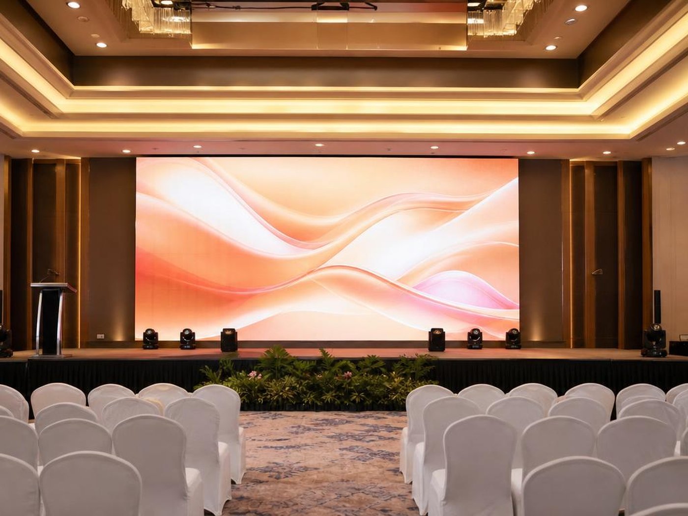 Setup panggung: riser, LED screen, truss lighting, line array speaker, dan kru produksi